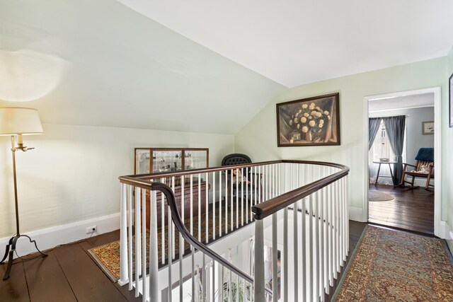 98 Main St, Winthrop, ME 04364 - corridor featuring an upstairs landing, vaulted ceiling, baseboards, and wood finished floors