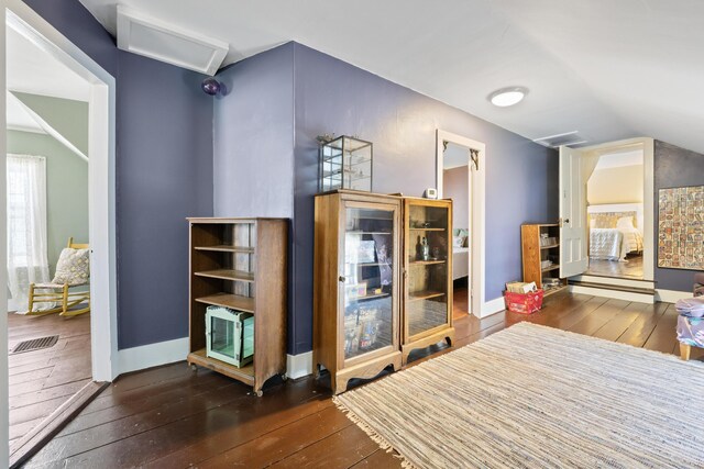 98 Main St, Winthrop, ME 04364 - interior space featuring hardwood / wood-style flooring, attic access, and vaulted ceiling