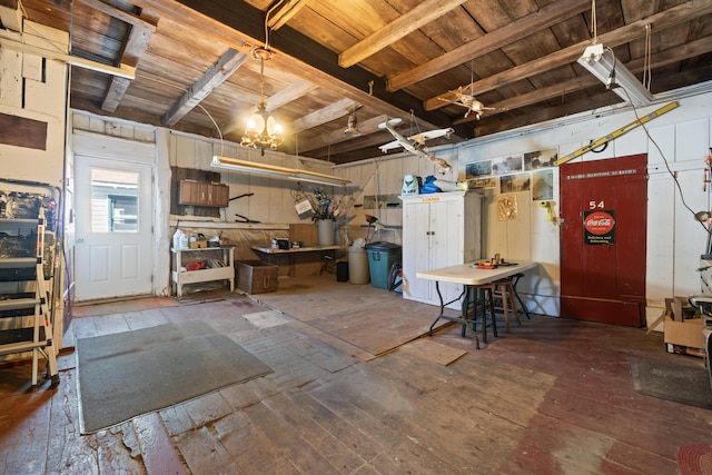 98 Main St, Winthrop, ME 04364 - basement featuring wood ceiling, a chandelier, and wood-type flooring