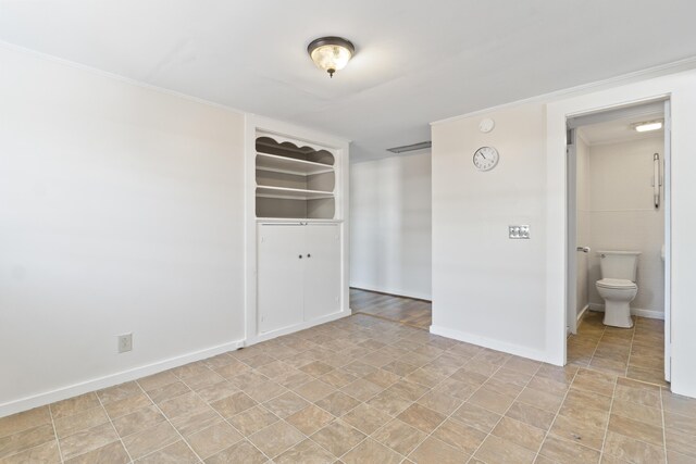 98 Main St, Winthrop, ME 04364 - empty room featuring baseboards, stone finish floors, and a smoke detector