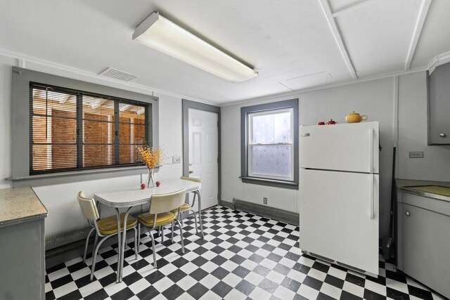 98 Main St, Winthrop, ME 04364 - kitchen featuring freestanding refrigerator, light flooring, and light countertops