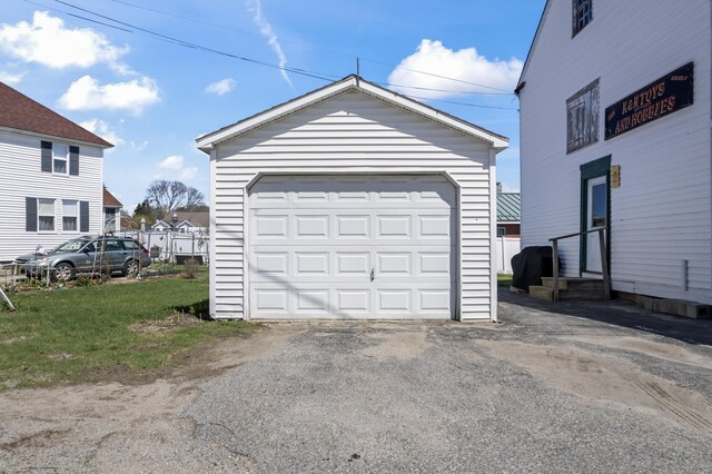 98 Main St, Winthrop, ME 04364 - detached garage featuring asphalt driveway
