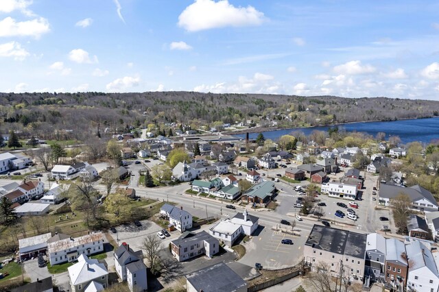 98 Main St, Winthrop, ME 04364 - aerial view of property and surrounding area featuring a nearby body of water, nearby suburban area, and a forest