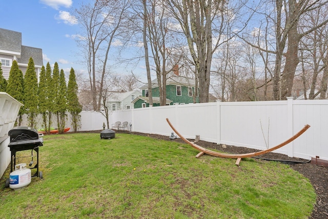 60 Grove St, Wells, ME 04090 - view of yard with an outdoor fire pit and a fenced backyard