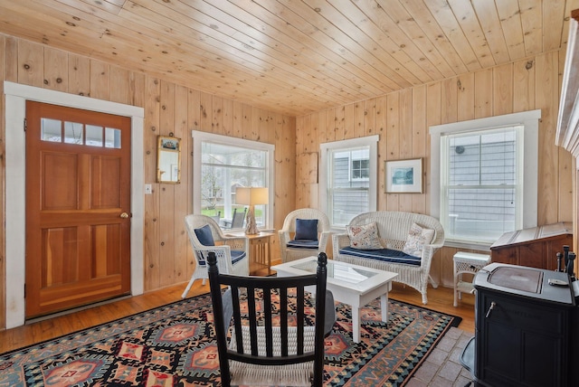 60 Grove St, Wells, ME 04090 - living area featuring wooden walls, wood ceiling, and wood finished floors
