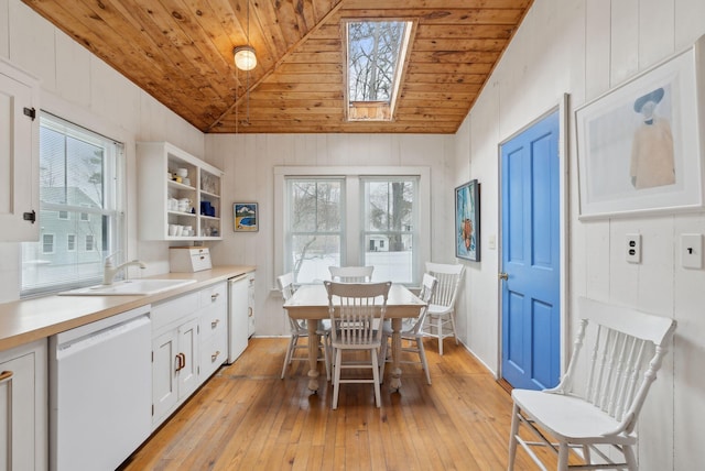 60 Grove St, Wells, ME 04090 - dining space featuring lofted ceiling with skylight, plenty of natural light, wooden ceiling, and light wood-style floors