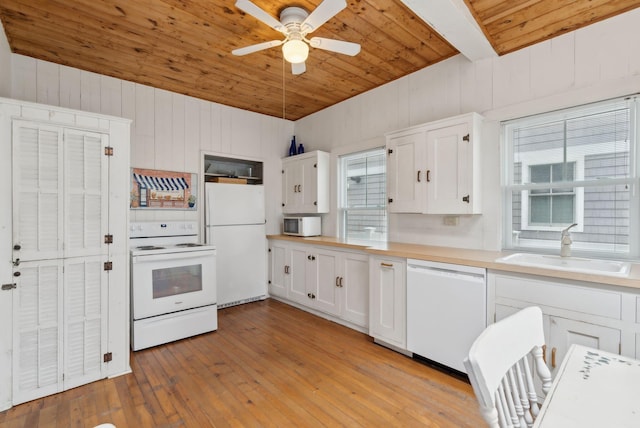 60 Grove St, Wells, ME 04090 - kitchen with a sink, ceiling fan, white appliances, light countertops, and wooden ceiling