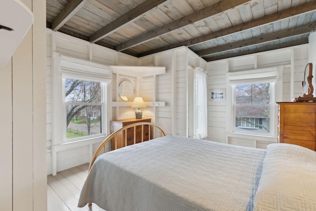 60 Grove St, Wells, ME 04090 - bedroom featuring wooden ceiling, wood finished floors, beamed ceiling, and multiple windows