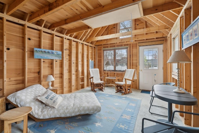 60 Grove St, Wells, ME 04090 - sitting room featuring wood walls, wood ceiling, carpet floors, and vaulted ceiling with beams