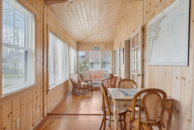 60 Grove St, Wells, ME 04090 - sunroom featuring lofted ceiling, wood walls, and wood-type flooring