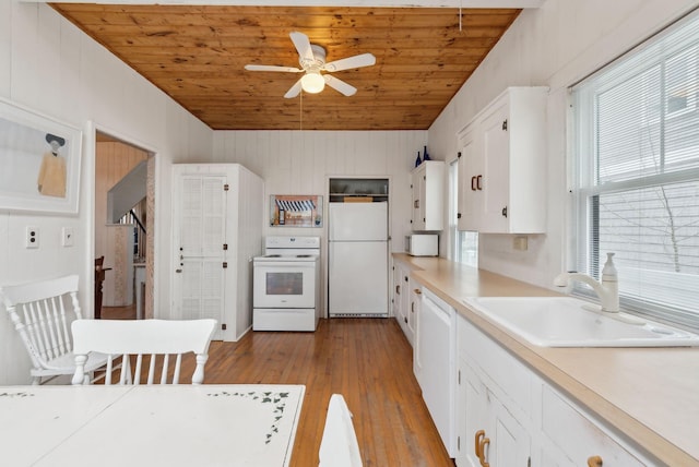 60 Grove St, Wells, ME 04090 - kitchen with a wealth of natural light, wood ceiling, a sink, and white appliances