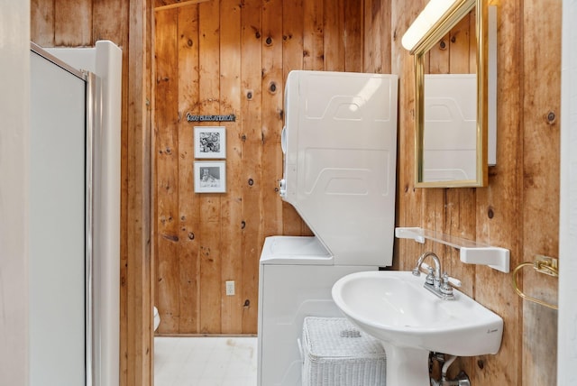 60 Grove St, Wells, ME 04090 - full bathroom featuring wood walls, a shower with shower door, and a sink