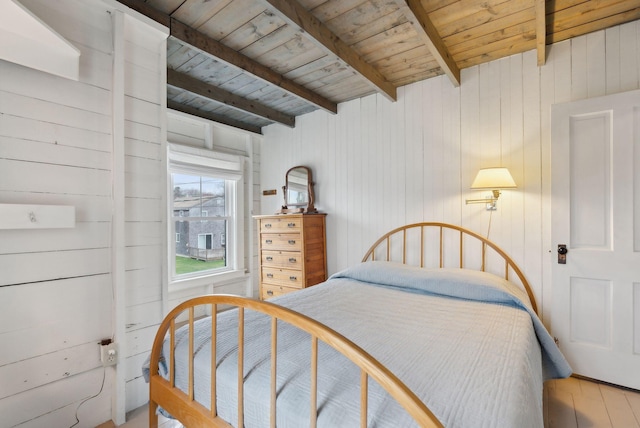 60 Grove St, Wells, ME 04090 - bedroom with wood ceiling, wood walls, wood finished floors, and beam ceiling