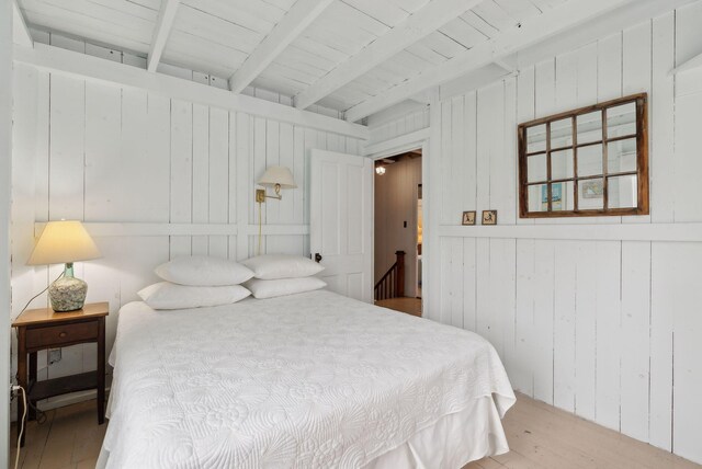 60 Grove St, Wells, ME 04090 - bedroom with wooden ceiling, beam ceiling, wooden walls, and wood finished floors