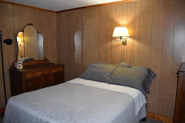 bedroom with wood walls
