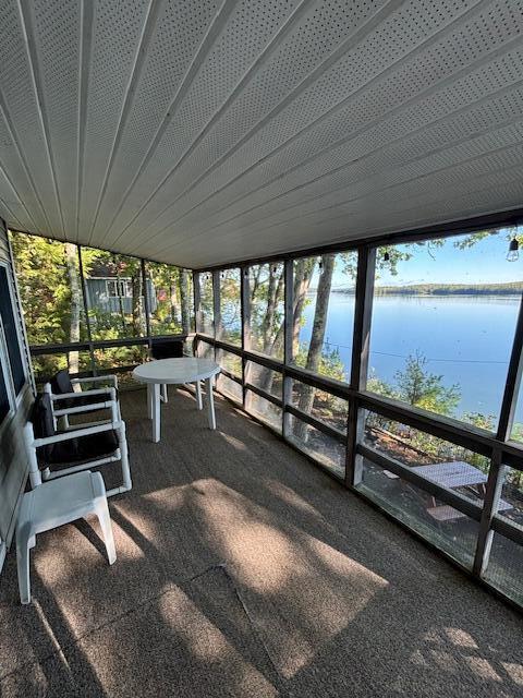 sunroom with a water view