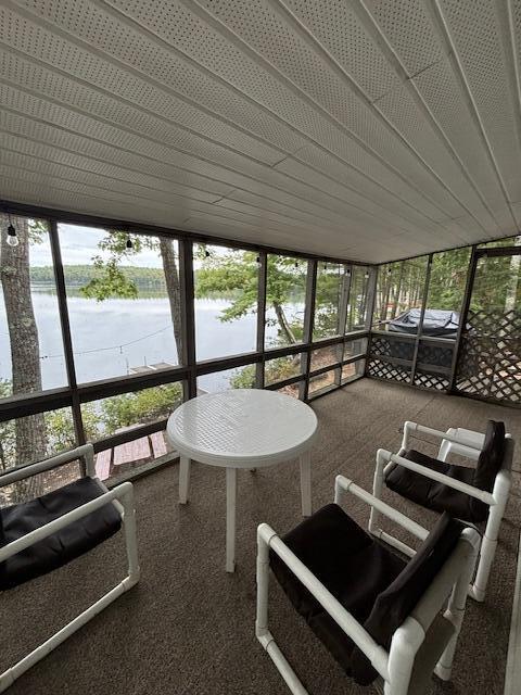 sunroom with a water view
