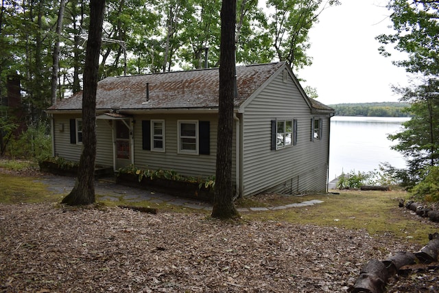 exterior space with a water view