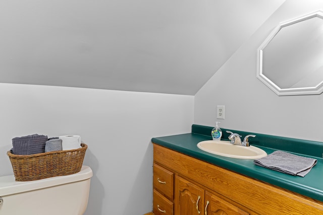 397 New Bridge Rd, Acton, ME 04001 - half bathroom with toilet, vanity, and vaulted ceiling