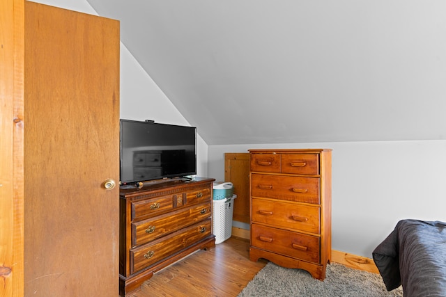 397 New Bridge Rd, Acton, ME 04001 - bedroom with vaulted ceiling and wood finished floors