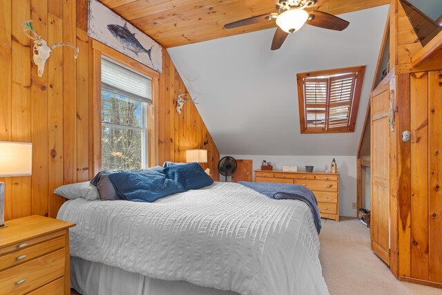 397 New Bridge Rd, Acton, ME 04001 - bedroom with lofted ceiling, light carpet, wood walls, and a ceiling fan