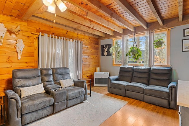 397 New Bridge Rd, Acton, ME 04001 - living area with beamed ceiling, light wood finished floors, ceiling fan, wooden walls, and wooden ceiling