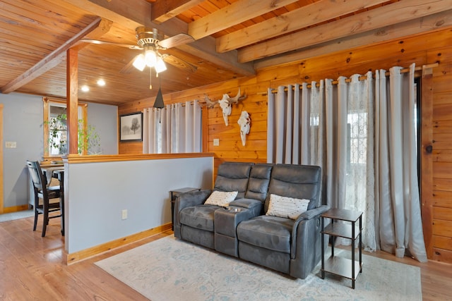 397 New Bridge Rd, Acton, ME 04001 - living room with wooden ceiling, ceiling fan, wood finished floors, beam ceiling, and baseboards