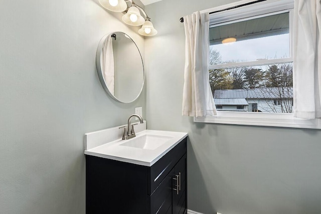 bathroom with baseboards and vanity