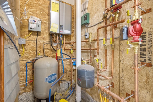 utility room with tankless water heater