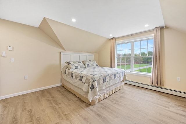 bedroom with vaulted ceiling, light wood-style floors, recessed lighting, a baseboard radiator, and baseboards