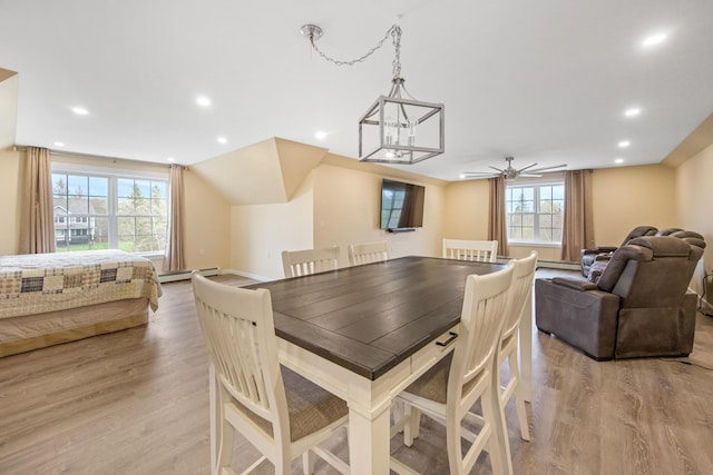 dining area with light wood-style flooring, healthy amount of natural light, recessed lighting, a ceiling fan, and baseboard heating