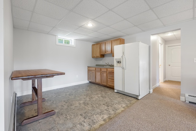 48 White Mountain Way, Bridgton, ME 04009 - kitchen with white refrigerator with ice dispenser, a sink, a drop ceiling, baseboards, and light countertops