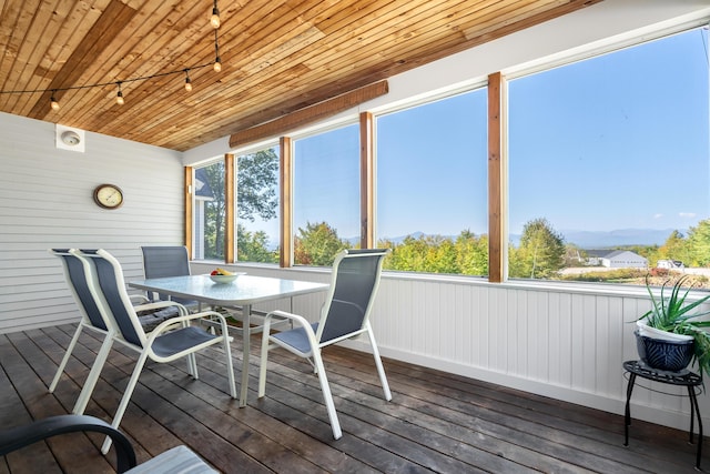48 White Mountain Way, Bridgton, ME 04009 - sunroom / solarium with rail lighting, wooden ceiling, wood-type flooring, outdoor dining area, and plenty of natural light