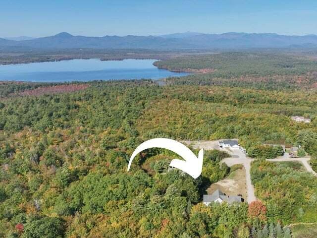 48 White Mountain Way, Bridgton, ME 04009 - aerial overview of property's location featuring a forest and a water and mountain view