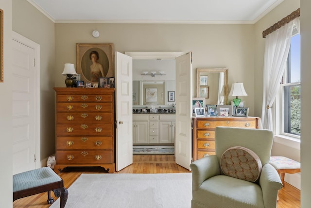94 Neal St Unit 2N, Portland, ME 04102 - sitting room with ornamental molding and light wood-style flooring