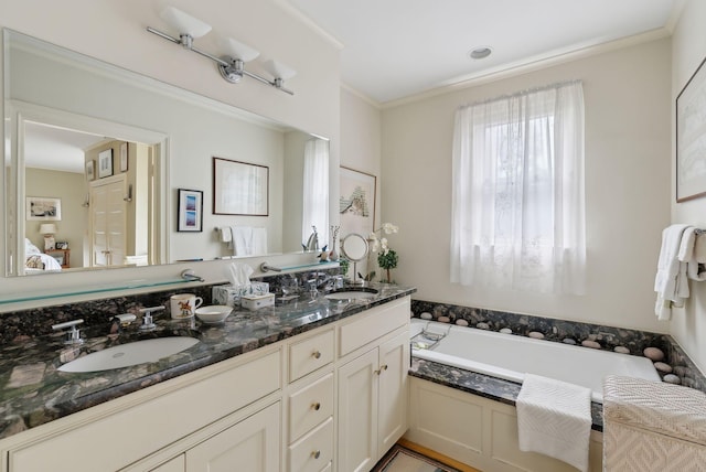 94 Neal St Unit 2N, Portland, ME 04102 - ensuite bathroom featuring double vanity, a bath, and crown molding
