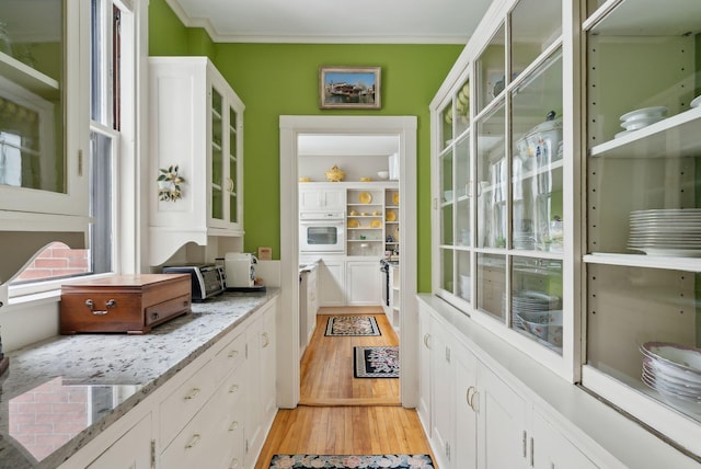 94 Neal St Unit 2N, Portland, ME 04102 - entryway featuring light wood finished floors and crown molding