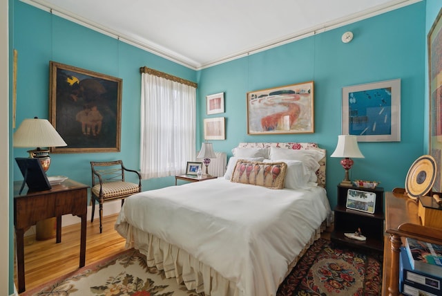 94 Neal St Unit 2N, Portland, ME 04102 - bedroom featuring wood finished floors and ornamental molding