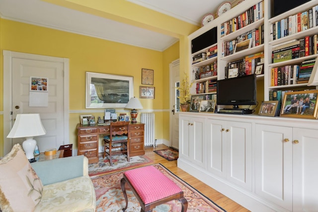 94 Neal St Unit 2N, Portland, ME 04102 - sitting room featuring radiator heating unit, light wood finished floors, and a desk