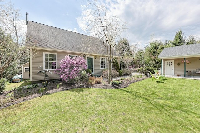 8 Codys Way, Bridgton, ME 04009 - back of house featuring a lawn and a shingled roof