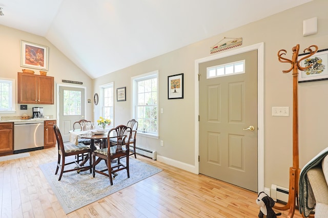 8 Codys Way, Bridgton, ME 04009 - dining room with plenty of natural light, light wood-style floors, a baseboard radiator, and lofted ceiling