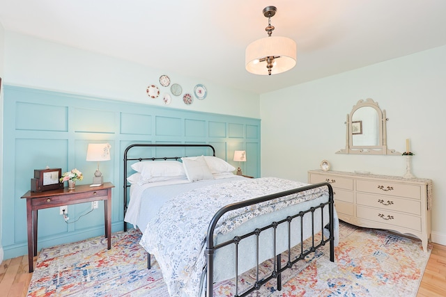 8 Codys Way, Bridgton, ME 04009 - bedroom with a decorative wall and light wood-style flooring