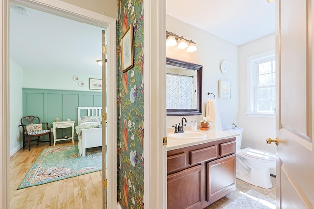 8 Codys Way, Bridgton, ME 04009 - bathroom featuring toilet, vanity, and wood finished floors