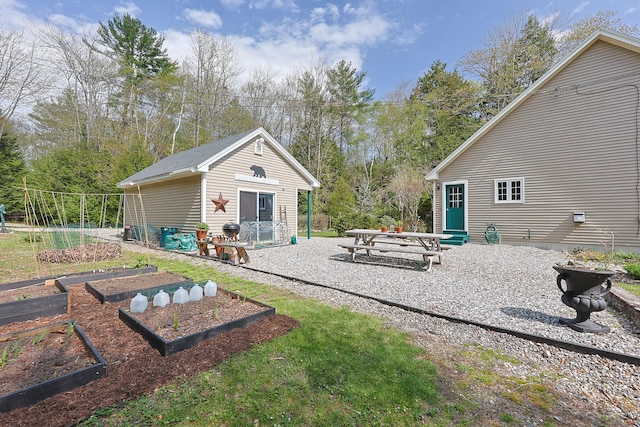 8 Codys Way, Bridgton, ME 04009 - view of yard featuring a vegetable garden and an outdoor structure
