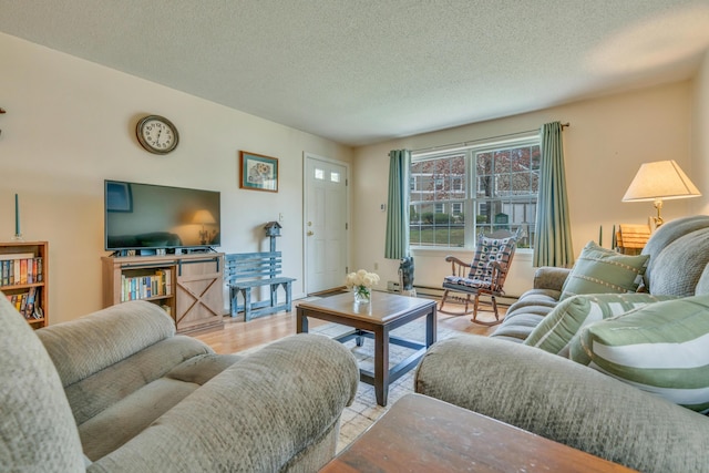 living room with a textured ceiling and wood finished floors