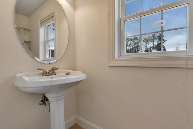 bathroom with baseboards