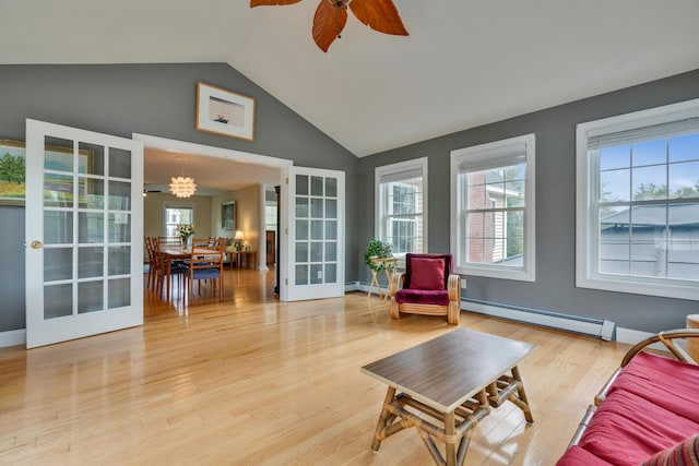 sunroom with a baseboard heating unit, healthy amount of natural light, lofted ceiling, french doors, and baseboard heating