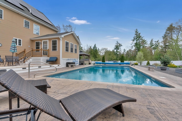 view of pool featuring a patio area, a gazebo, and fence