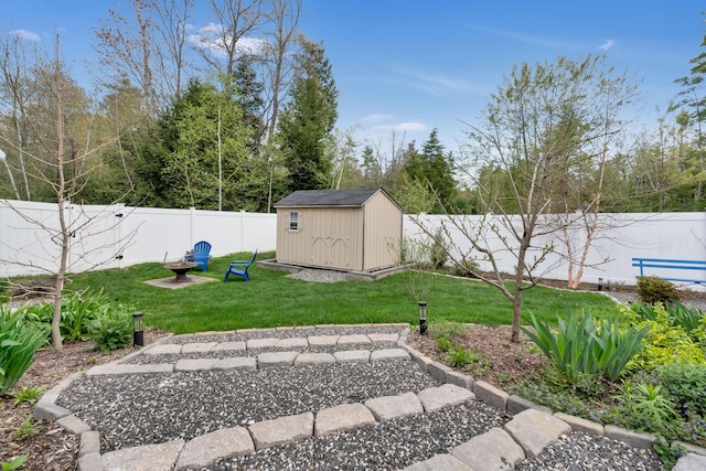 view of yard featuring a storage shed and an outbuilding