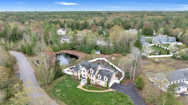 aerial view of property's location with a heavily wooded area
